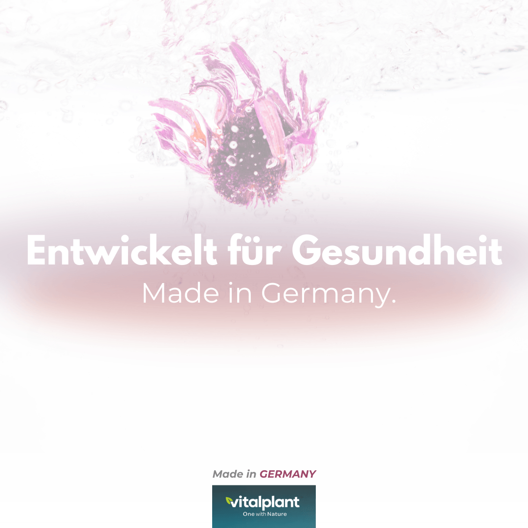 Entwickelt für Gesundheit, Made in Germany, Produkt von Vitalplant, unter Wasser mit rosa Blüten.