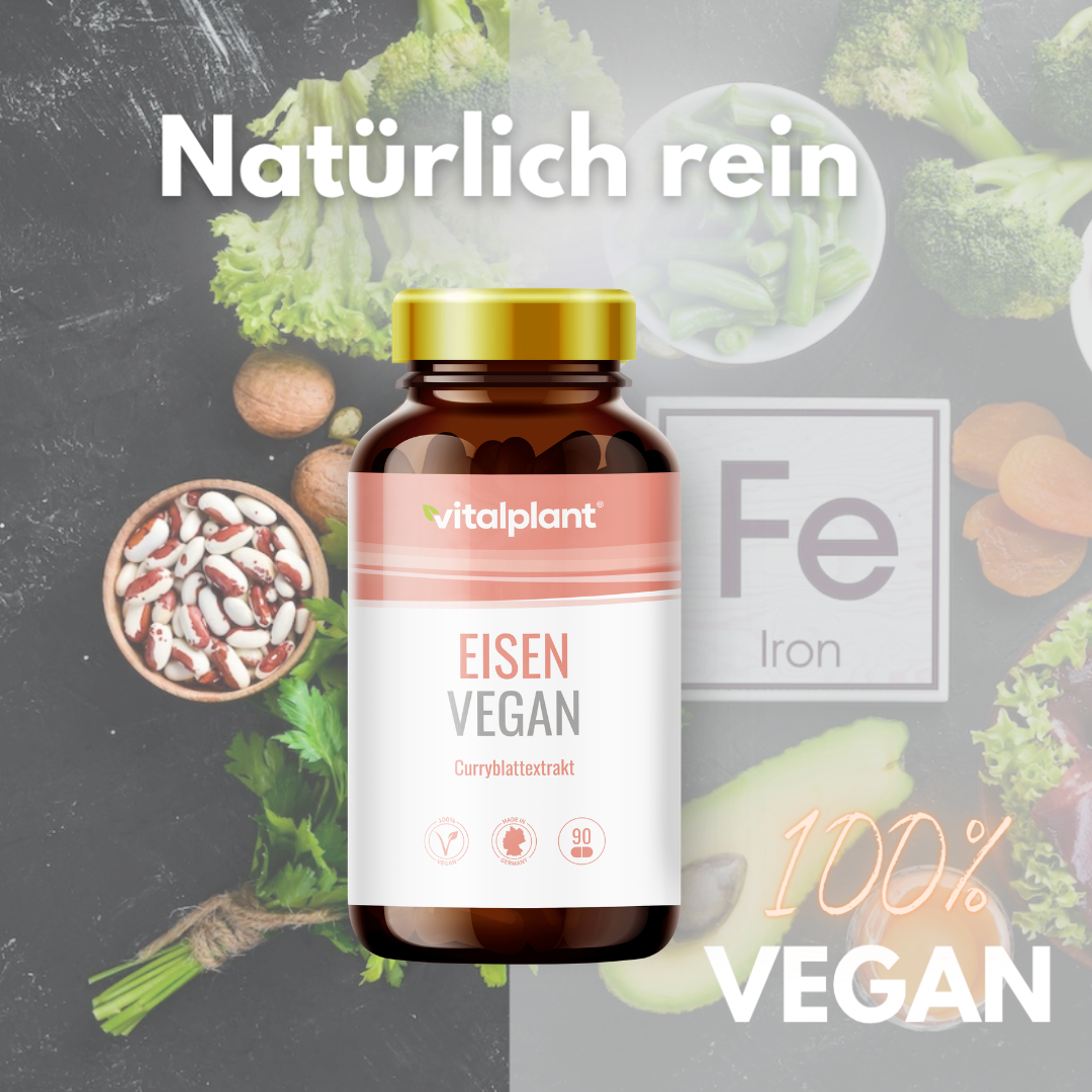 Vegan iron by Vitalplant in a bottle with curry leaf extract and fresh vegetables in the background.