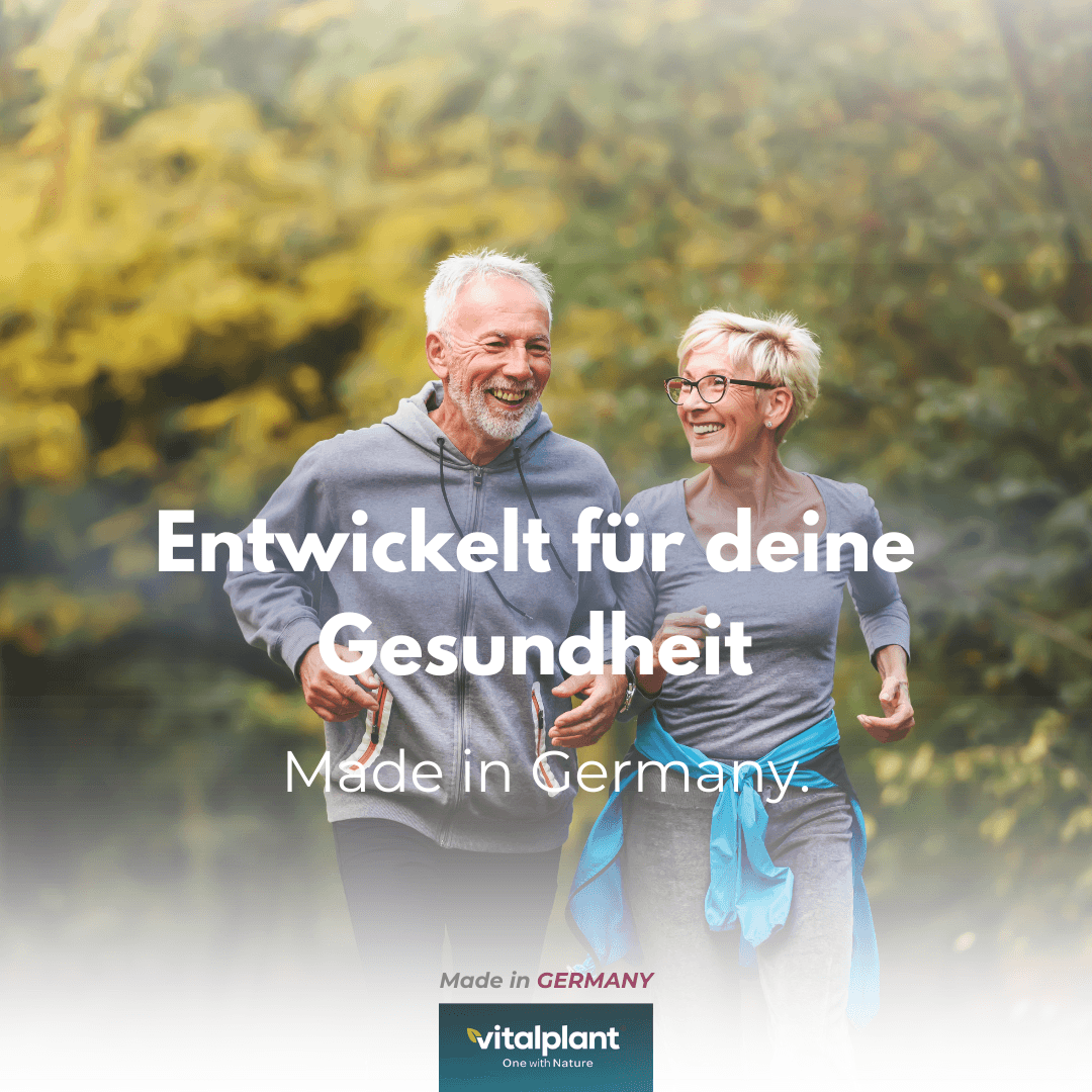 Two happy people in the park, developed for your health, Heart Complex by vitalplant, Made in Germany.