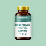 Mariendistel Komplex Kapseln von Vitalplant in einem modernen Fläschchen auf grünem Hintergrund.